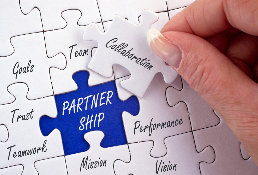 Partnership,Business,Concept,With,Female,Hand,And,Puzzle